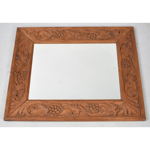 541 - A Carved Framed Rectangular Wall Mirror, 63cm x 77cm