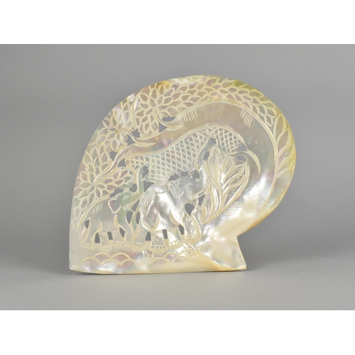 58 - A Large Section of Carved and Pierced Mother of Pearl Shell Decorated with Elephants, 17cm High