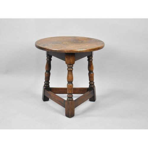 65 - A 20th Century Circular Oak Coffee Table with Cricket Style Supports, 44cm diameter