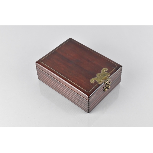 42 - A Chinese Qing Dynasty Hardwood Box with Ribbed Sides and Bronze Bat Motif Mount, the Hinged Lid Ope... 