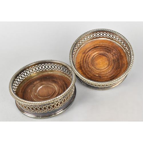 101 - A Pair of Mid 20th Century Silver Plated Pierced Bottle Coasters, 11.5cms Diameter