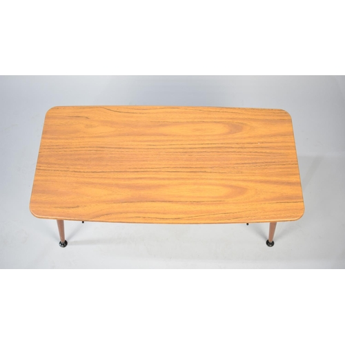 104 - A 1970's Rectangular Coffee Table with Metal Magazine Stretcher Under, 75cms Wide