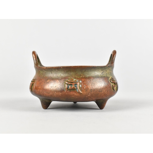 119 - A Reproduction Bronze Two Handled Censer with Relief Calligraphy Decoration and Six Character mark t... 