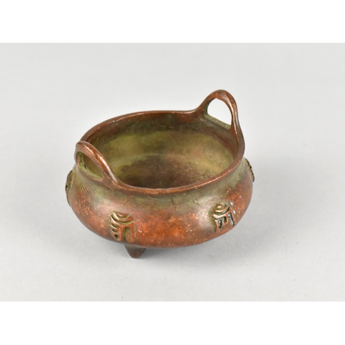 119 - A Reproduction Bronze Two Handled Censer with Relief Calligraphy Decoration and Six Character mark t... 