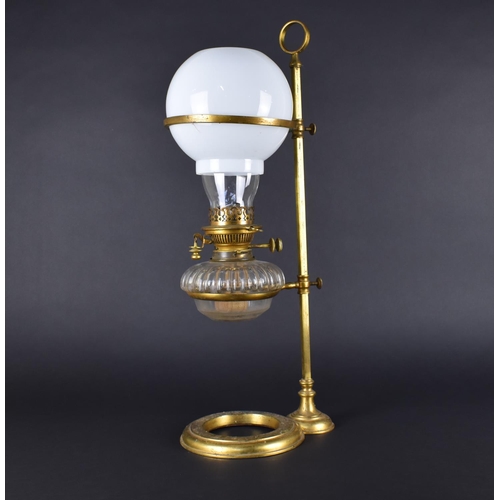 23 - A Late Victorian Rise and Fall Oil Lamp with Glass Reservoir and Chimney and Opaque Glass Globe Shad... 