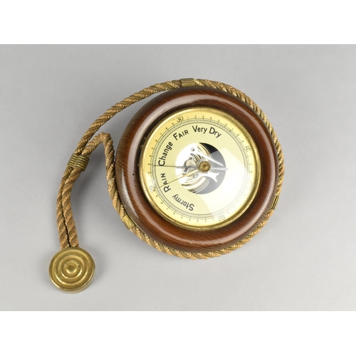 28 - A Mid 20th Century Wall Hanging Circular Aneroid Barometer with Rope Suspension, 15cms Diameter