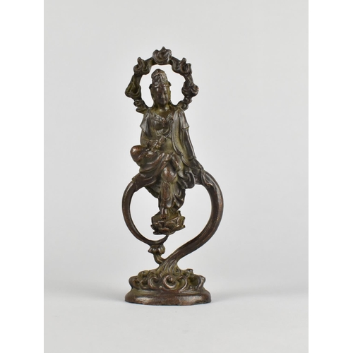 32 - A Patinated Bronze Study of Guan Yin, Seated and with Garland Halo, 17cms High