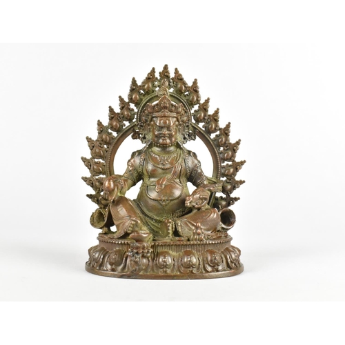 33 - A Patinated Bronze Study of Seated Crowned Buddha Set on Lotus Throne, 11cms High