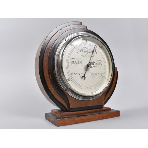 34 - An Art Deco Circular Free Standing Aneroid Barometer, 22cms Diameter