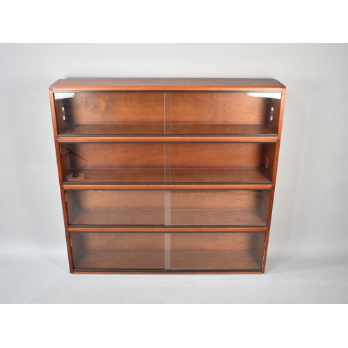 552 - A 1970s Glazed Four Section Bookcase by Simplex, 122cm Wide