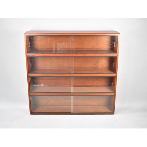 553 - A 1970s Glazed Four Section Bookcase by Simplex, 122cm Wide