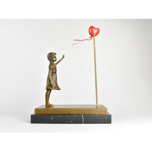 56 - A Modern Bronze and Marble Model Depicting The Famous Banksy Painting, 