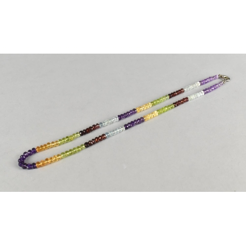 437 - A Gem Set Bead Necklace comprising Various Stone Beads to include Amethyst, Garnet, Citrine, Peridot... 