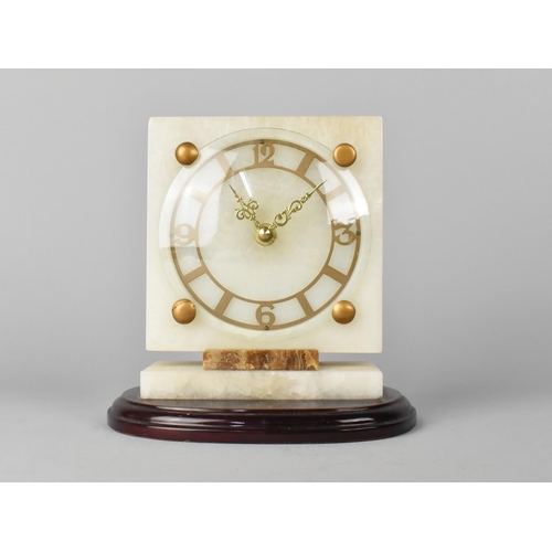 22 - An Art Deco Style Mantel Clock with Battery Movement, 18cms High