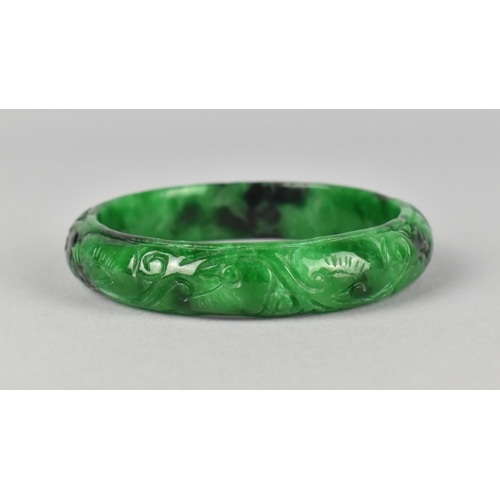 435 - A Carved Jade Effect Bangle, 7.5cm Diameter