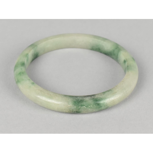 438 - A Moss Jade Effect Bangle, 7cm Diameter