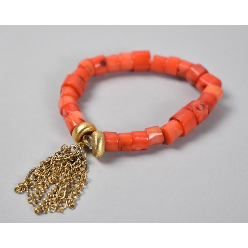 440 - A Coral Bracelet with Gold Plated Textured Beads and Chain Tassels, 26.8gms