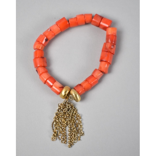 440 - A Coral Bracelet with Gold Plated Textured Beads and Chain Tassels, 26.8gms