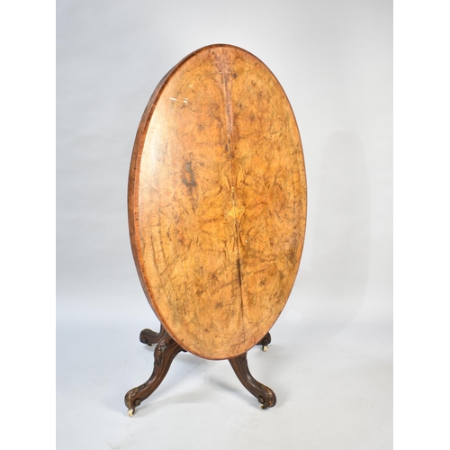 476 - A Victorian Inlaid Burr Walnut Oval Snap Top Breakfast Table on Quadrant Base, 121cms by 87cms