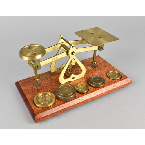 61 - A Reproduction Brass Postage Scale with Weights, 17.5cms Wide