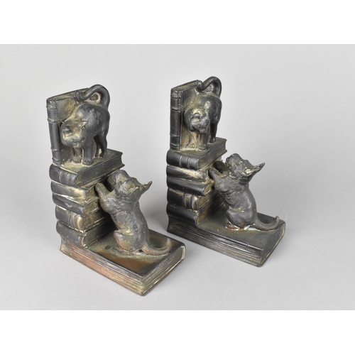 62 - A Pair of Japanese Spelter Novelty Bookends in the From of Dog Chasing Cat Stood on Book, 15cms High