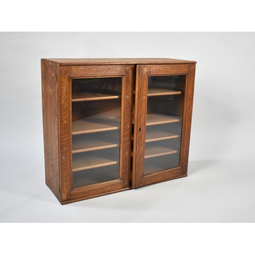 70 - An Early 20th Century Oak Glazed and Shelved Wall/Table Top Cabinet, 51cms Wide, 20cms Deep and 53cm... 