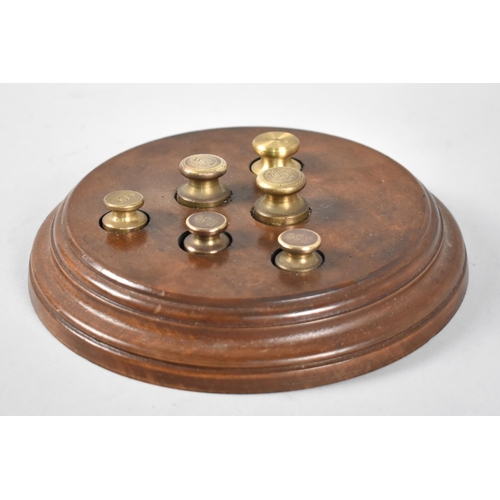 111 - A Mid 20th Century Set of Travelling Metric Weights Mounted on Circular Wooden Plinth, 18cms Diamete... 