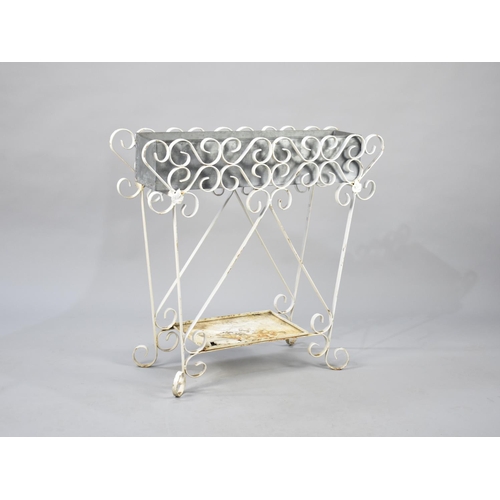 482 - A White Painted Wrought Iron Plant Stand with Stretcher Shelf, 73x68cm high