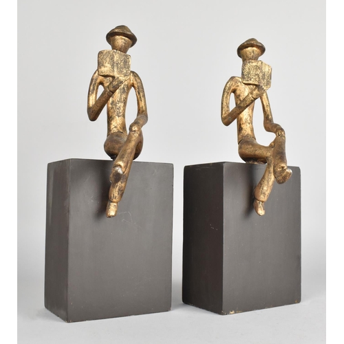 52 - A Pair of Novelty Bookends in the Form of Gilt Sprayed Figures of Seated Men on Rectangular Plinths,... 