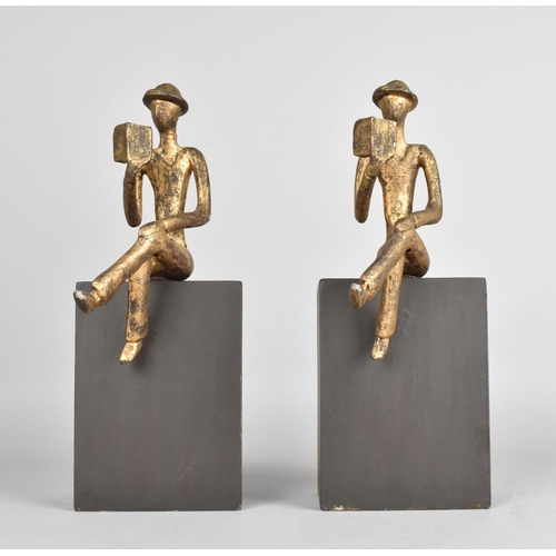 52 - A Pair of Novelty Bookends in the Form of Gilt Sprayed Figures of Seated Men on Rectangular Plinths,... 