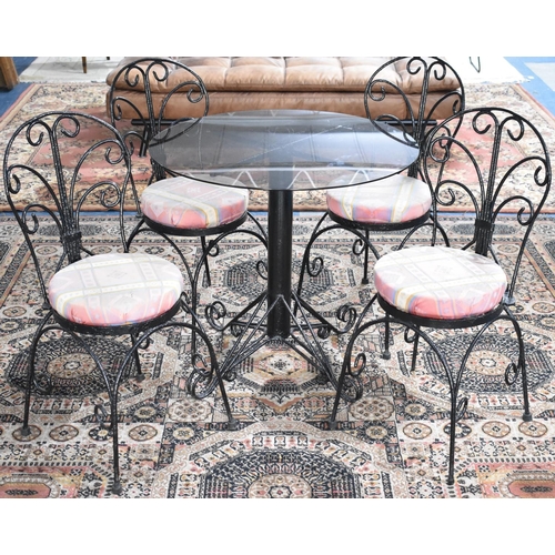 541 - A Modern Wrought Iron Framed Patio Set Comprising Circular table and Four Chairs