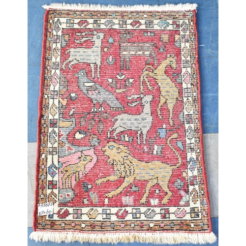 545 - A Small Patterned Hearth Rug Depicting Animals and Birds, 85x60cms