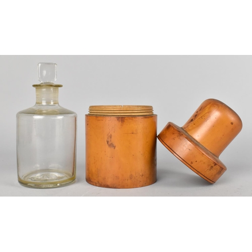 69 - A Circular Treen Case with Screw Off Top Containing Glass Bottle with Stopper, 14cms High