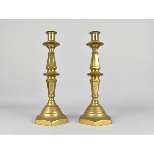 83 - A Pair of 19th Century Brass Candlesticks with Pushers, 30cms High