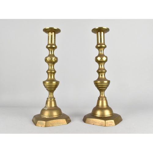 89 - A Pair of 19th Century Brass Candlesticks with Pushers, 30cms High