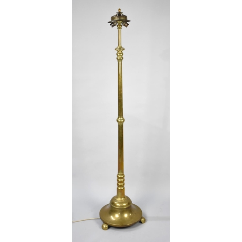 91 - A Heavy Brass Two Branch Standard Lamp on Circular Base with three Scrolled Feet, No Shade