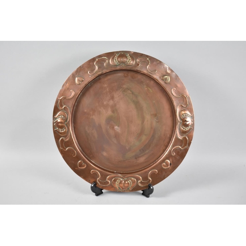 95 - An Art Nouveau Copper Circular Tray by Joseph Sankey, Wolverhampton, Stylised Tulip Decoration in Re... 