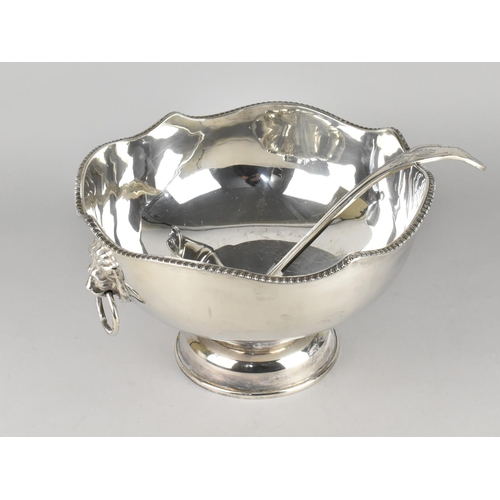 105 - A Mid 20th Century Silver Plated Punch Bowl with Lion Mask Ring Handles and a Kings Pattern Punch La... 