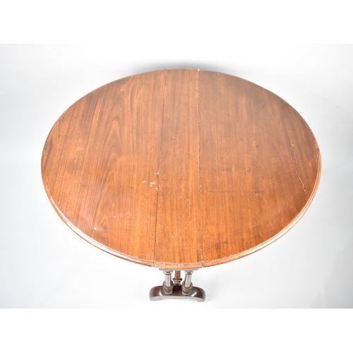 110 - A Late Victorian/Edwardian Mahogany Drop Leaf Sutherland Table with Oval Top, Turned Supports, 86cms... 