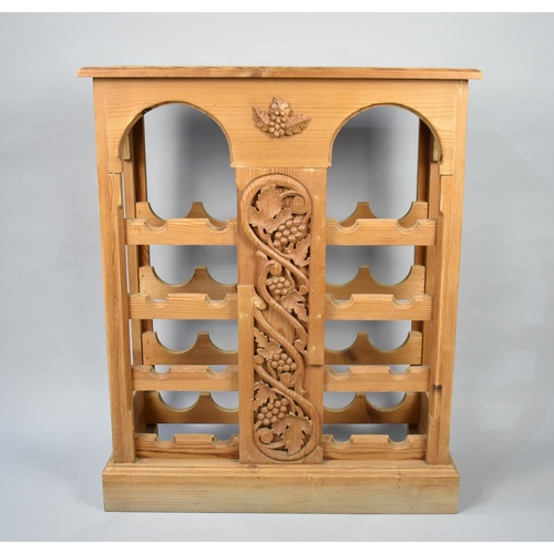 111 - A Modern Pine Sixteen Bottle Wine Rack with Carved Centre Panel, 68cms Wide