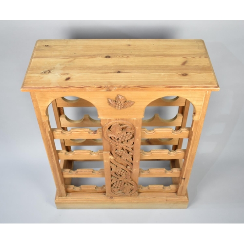 111 - A Modern Pine Sixteen Bottle Wine Rack with Carved Centre Panel, 68cms Wide