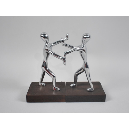 118 - A Pair of Modern Chromed Figural Bookends, 18cm High