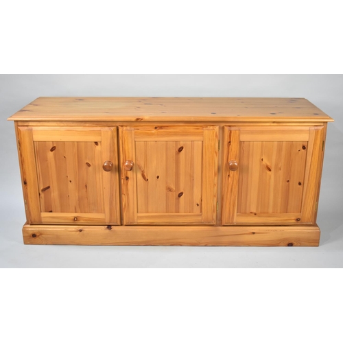 194 - A Modern Pine Side Cabinet with Three Panelled Doors, 144cms Wide and 65cms High