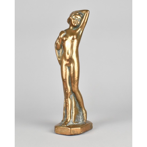 25 - A Heavy Cast Bronze Study of a Standing Nude with Arms Raised, 22cms High