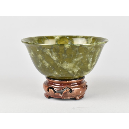 268 - A Chinese Spinach Green Jade Bowl with Flared Rim on a Ring Foot, 10cm diameter