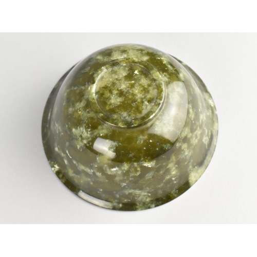 268 - A Chinese Spinach Green Jade Bowl with Flared Rim on a Ring Foot, 10cm diameter