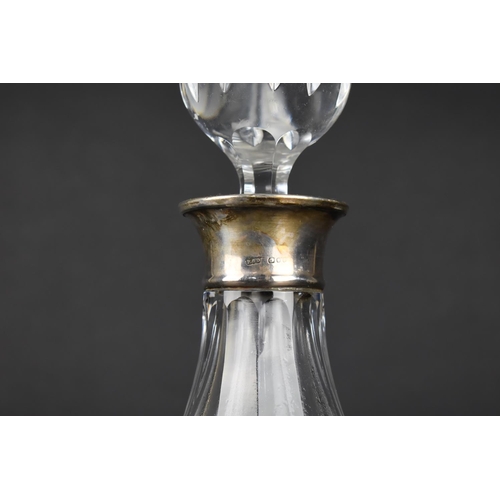 380 - A Cut Glass and Silver Decanter, the Silver Cuff with London Hallmark by Roberts & Dore Ltd