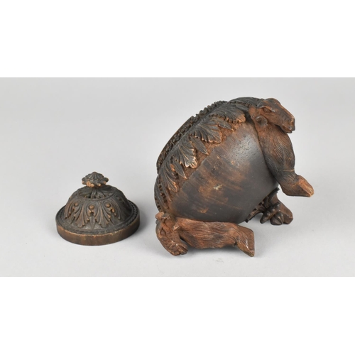 44 - A Carved Indian Wooden Lidded Circular Pot on Three Goat Supports, 9cms Diameter and 11cms High