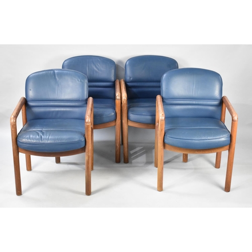 497 - A Set of Four Gordon Russell Teak Framed and Leather Upholstered Armchairs