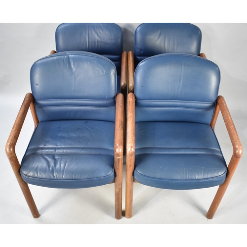 497 - A Set of Four Gordon Russell Teak Framed and Leather Upholstered Armchairs